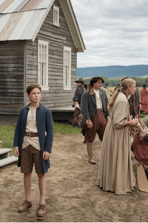 Colonial-era Jamestown settlement scene with a young boy and settlers in 17th-century clothing, representing early American history in 5th Grade California Standards.