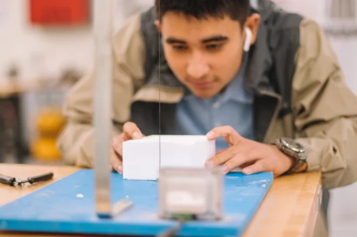Student developing hands-on skills in shop class, highlighting the value of AI and skilled trades